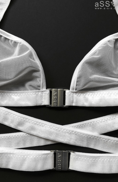 High-cut thong with wide straps, suspender belt and adjustable suspender straps.  The top crosses over at the back and can also be adjusted